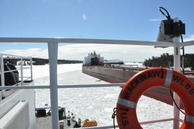 The Cutter Mackinaw comes ahead and creates a track through the ice for the motor vessel James R. Barker (which had become stuck in brash ice) to follow in the vicinity of the Johnson Point Turn in the lower St. Marys River. Photo: USCG