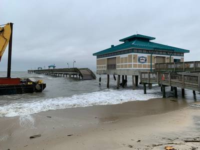 The damaged James T. Wilson fishing pier with debris on the deck of the barge is depicted in this photo taken Nov. 17, 2019. (Photo Credit: U.S. Coast Guard)