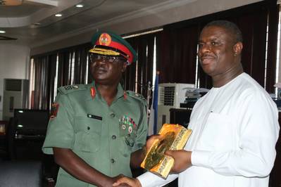 The Director General of the Nigerian Maritime Administration and Safety Agency (NIMASA), Dr. Dakuku Peterside receiving a plaque from the General Officer Commanding (GOC) 81 Division of the Nigerian Army, Major General Peter John Dauke when the GOC paid a courtesy visit to the NIMASA DG at the Agency’s headquarters in Lagos. (Photo: NIMASA)