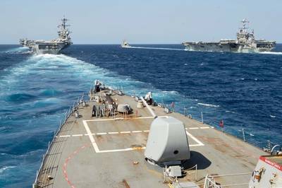 The guided-missile destroyer USS Arleigh Burke (DDG 51) transits in formation with the guided-missile destroyer USS Mason (DDG 87), the guided-missile cruiser USS Normandy (CG 60), and the aircraft car-riers USS Abraham Lincoln (CVN 72) and USS Harry S. Truman (CVN 75) during dual-carrier sustainment and qualification operations in the Atlantic. (U.S. Navy photo by Mass Communication Specialist 2nd Class Justin Yarborough/Released)
