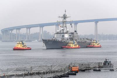 The guided-missile destroyer USS Kidd (DDG 100) arrives in San Diego, April 28, 2020, as part of the Navy's response to the COVID-19 outbreak onboard the ship. While in San Diego, the Navy will provide medical care for the crew and clean and disinfect the ship. (U.S. Navy photo by Alex Millar)