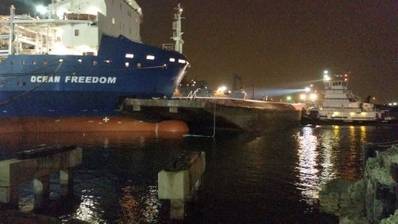 The Ocean Freedom, a 480-foot cargo ship, is connected to a moored Kirby Inland Marine barge after a collision in the Corpus Christi Inner Harbor Thursday. (U.S. Coast Guard photo by Gordon Bellinger)