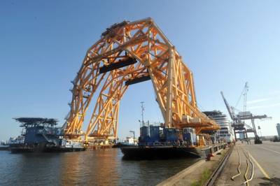 The twin-hull heavy lift vessel VB 10,000 at the Port of Fernandina, Fla. in July for modifications and function checks. The two 255-foot tall gantries will use lengths of chain to cut the capsized vessel Golden Ray into eight pieces and lift them onto barges for eventual transportation to Louisiana for recycling. (Photo: John D. Miller / U.S. Coast Guard)