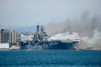 The USS Bonhomme Richard (LHD 6) burns while moored at Naval Base San Diego on July 12, 2020. Photo: John J. Mike / (U.S. Navy)