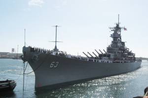 The USS Missouri leaves drydock after 12 weeks and $18 million worth of maintenance and preservation work in Pearl Harbor Naval Shipyard and returns home to Pier Foxtrot-5 on Battleship Row. The Mighty Mo drycoking project began on Oct. 14, 2009. Photo credit: USS Missouri Memorial Association