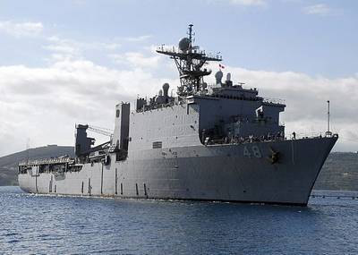 The Whidbey Island-class dock landing ship USS Ashland (LSD 48) arrives at the Marathi NATO Pier Facility for a routine port visit. Ashland is homeported at Navy Amphibious Base Little Creek, Va. and is deployed supporting maritime security operations. U.S. Navy photo by Paul Farley