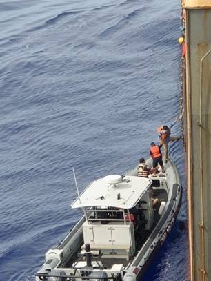 Those rescued being transferred to U.S. Coast Guard vessel. Photo courtesy NYK