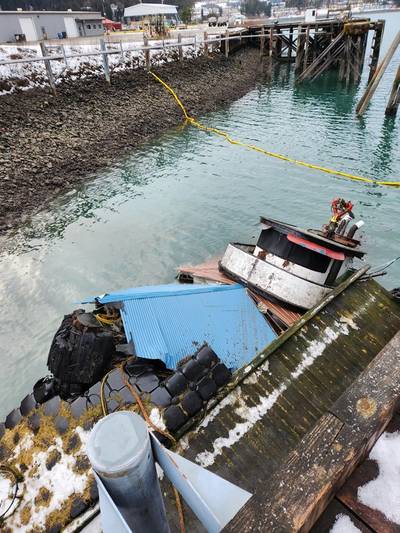 Tug vessel Tagish is partially submerged at the National Guard Dock in the vicinity of the Alaska Marine Lines yard in the Gastineau Channel, Juneau, Alaska, December 29, 2022. Coast Guard Sector Juneau crew members and contractors are responding the incident. (Photo: U.S. Coast Guard Sector Juneau)