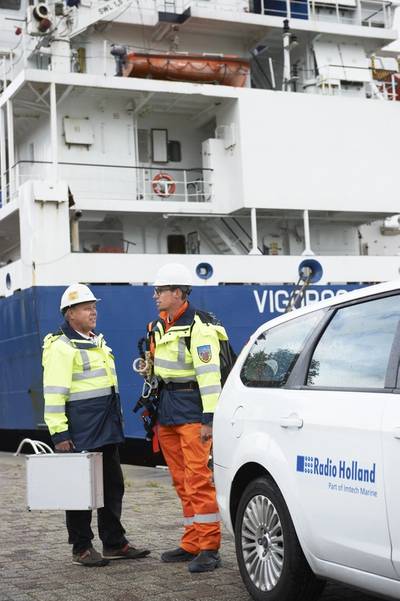 Two Radio Holland service engineers arriving at their job in the port of Rotterdam
