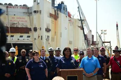 U.S. Coast Guard Capt. Zeita Merchant, the captain of the port and federal on-scene coordinator, addresses in front of the Grande Costa D’Avorio in Port Newark, New Jersey, July 11, 2023. (U.S Coast Guard photo by Petty Officer 3rd Class Mikaela McGee)