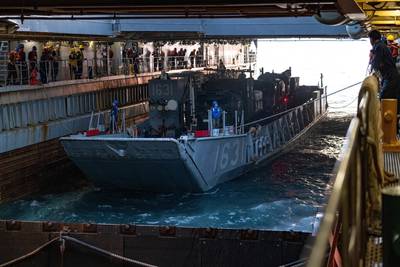 U.S. Navy Sailors aboard the amphibious dock landing ship USS Ashland (LSD-48), moor a landing craft, utility during amphibious operations, off the coast of Okinawa, Japan, in March 2023. (Photo: Christopher R. Lape / U.S. Marine Corps)