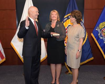 U.S Secretary of Transportation Secretary Elaine L. Chao administers the Oath of Office to Rear Adm. Mark H. Buzby, USN, Ret. as Maritime Administrator (L to R: Admiral Mark H. Buzby,  Gina Buzby and Secretary Elaine L. Chao) (Photo: MARAD)