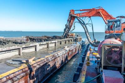 USACE Buffalo District contractor Ryba Marine Construction Co. pumps out dredged material from a scow in Toledo Harbor and into a confined disposal facility, Toledo, Ohio, November 4, 2020. (Photo: Jason Scott / U.S. Army Corps of Engineers)