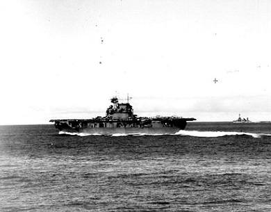USS Enterprise (CV-6) steaming at high speed at about 0725 hrs, June4,  1942, seen from USS Pensacola (CA-24). The carrier has launched Scouting Squadron Six (VS-6) and Bombing Squadron Six (VB-6) and is striking unlaunched SBD aircraft below in preparation for respotting the flight deck with torpedo planes and escorting fighters. (Official U.S. Navy Photograph, U.S. National Archives.)