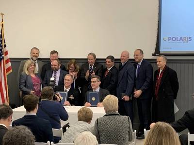 NUWC Division Newport Commanding Officer Capt. Mike Coughlin (seated left) and Polaris Manufacturing Extension Partnership Center Director, Christian Cowan (seated right) signed a Partnership Intermediary Agreement. (Photo by Jeff Prater/Released)