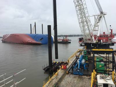 A Weeks Marine crane prepares to drive a pile using a vibratory hammer on February 26, 2020, near St. Simons Island, Ga., as part of the construction of the environmental protection barrier (EPB) around the motor vessel Golden Ray. (Photo by Tyler Drapeau)