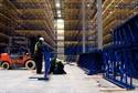 Workers finish construction of the racks that will hold frozen poultry inside the new Nordic facility in Pooler.