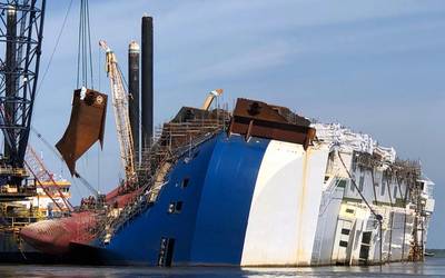 A crane positions the 16th and final lifting lug onto the Golden Ray hull in St. Simons Sound, Ga. (Photo: St. Simons Sound Incident Response)