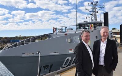 Patrick Gregg (Left) and David Singleton standing in front of a Guardian-class patrol Boat at Austal's Australian shipyard in Henderson, Western Australia. (Photo: Austal)