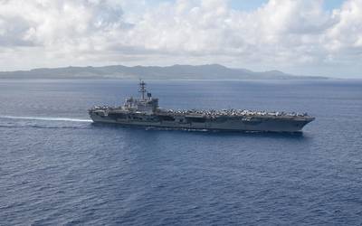 The aircraft carrier USS Theodore Roosevelt (CVN 71) returns to operations in the Philippine Sea on May 21 following an extended visit to Guam in the midst of the COVID-19 global pandemic. (U.S. Navy photo by Kaylianna Genier)