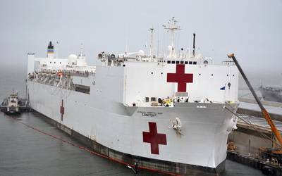 USNS Comfort (T-AH 20) takes on fuel and supplies at Naval Station Norfolk, Va. in preparation to deploy to New York in support of the nation’s COVID-19 response efforts and will serve as a referral hospital for non-COVID-19 patients currently admitted to shore-based hospitals. (U.S. Navy photo by Jim Kohler)