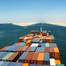 File Image: a boxship transits the suez Canal in better weather (CREDIT: © Andriy Kovach / AdobeStock)