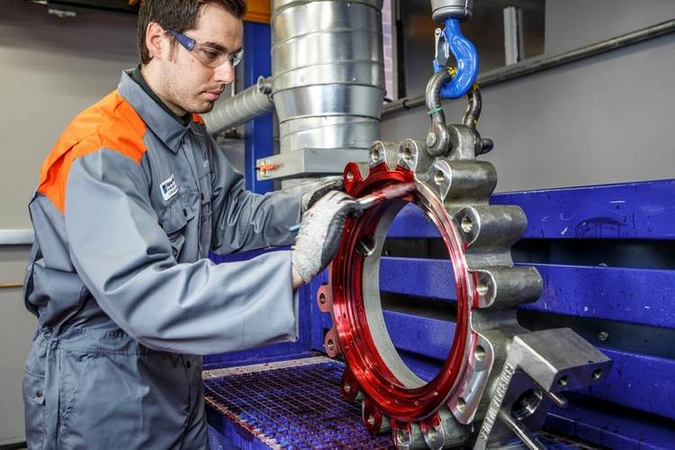 A butterfly valve undergoing liquid penetrant inspection to check integrity of casting quality
