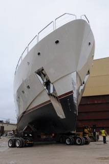 A complex 90-degree turn on the superyacht’s trek from fabrication facility to open water would not have been possible without Powered Holland Dollies moving the front of this small oceanliner independently from its back. The dollies are run hydrostatically and by remote control.
