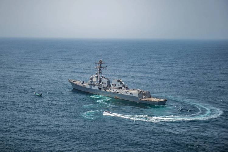 A visit, board, search and seizure team from the USS Jason Dunham (DDG 109) approach a skiff during maritime security operations. (U.S. Navy photo by Jonathan Clay)