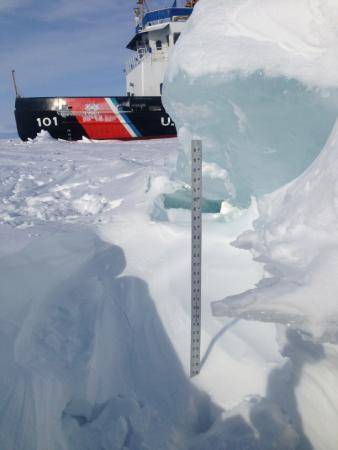 A yardstick measures the thickness of some of the ice that the crew of Coast Guard Cutter Katmai Bay is battling during ice-breaking operations in the Straits of Mackinac Feb. 5, 2014. The crew of the Katmai Bay, homeported in Sault Ste. Marie, Mich., along with the crew of Coast Guard Cutter Bristol Bay, homeported in Detroit, have spent the past few days trying to keep the Straits open to shipping traffic. (U.S. Coast Guard photo by Lt. Michael Patterson)