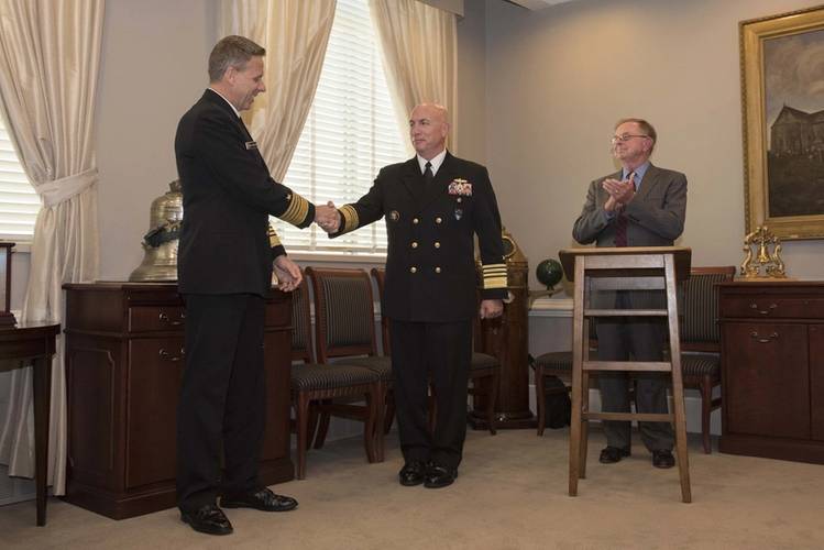 Adm. Kurt W. Tidd, commander of U.S. Southern Command, right, shakes hands with Adm. Phil Davidson, commander of U.S. Indo-Pacific Command, after turning over the Old Salt Award during a ceremony at the Pentagon. Davidson received the Old Salt award which is sponsored by the Surface Navy Association (SNA) and is given to the longest serving active-duty officer who is surface warfare officer (SWO) qualified. (U.S. Navy photo by Mass Communication Specialist 2nd Class Paul L. Archer/Released)