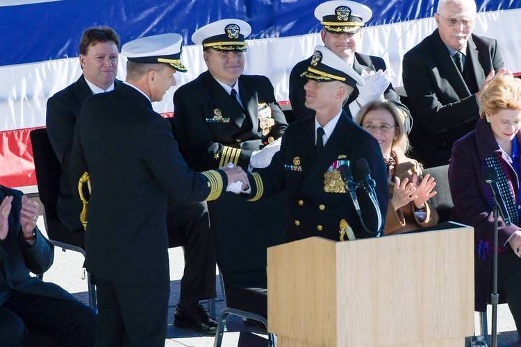 Adm. Phil Davidson (left), commander, U.S. Fleet Forces Command (USFF), congratulates Cmdr. Michael Desmond, commander, USS Detroit (LCS 7), during the commissioning ceremony for the Navy's newest Freedom-variant littoral combat ship. (U.S. Navy photo courtesy of Lockheed Martin)