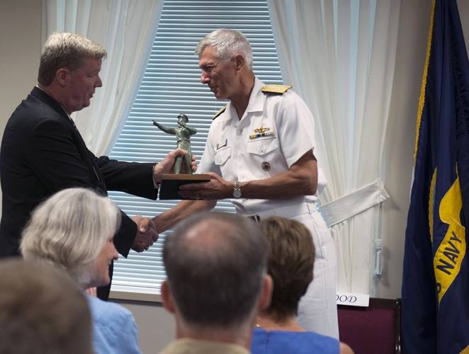 Adm. Sam Locklear accepts the "Old Salt" award from Surface Navy Association President, Vice Ad. Barry McCullough, USN, Ret., during a ceremony at the Pentagon in Washington, D.C. Locklear was the 18th recipient of the "Old Salt" award, presented to the longest serving surface warfare officer on continuous active duty. (US Navy photo by Tyrell K. Morris)