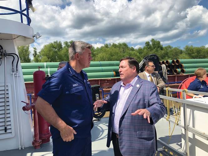 Admiral Karl Schultz, Commandant, USCG discussing the situation on the Lower Mississippi River with Lt. Governor Billy Nungesser – State of Louisiana. Photo: Greg Trauthwein
