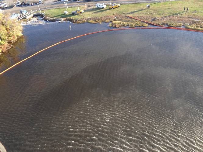 Aerial view of the oil spill near the Ronald Reagan Washington National Airport, Oct. 30, 2015. A safety zone was established with a 1,500-yard radius from source of the spill. (U.S. Coast Guard photo by Nicholas Rodriguez)