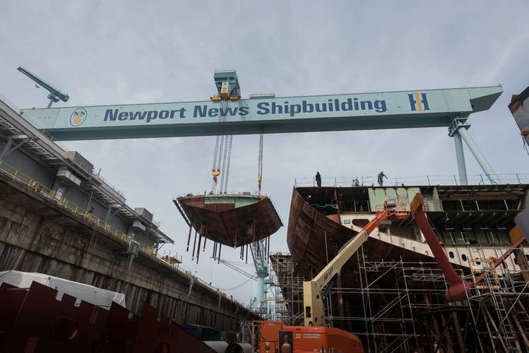 After several days of preparations, the aircraft carrier John F. Kennedy’s 932-metric ton lower stern lift took about an hour to complete, thanks to a team of about 25 Newport News shipbuilders—from riggers and the crane operator to shipwrights and ship fitters. (Photo: Matt Hildreth/HII)