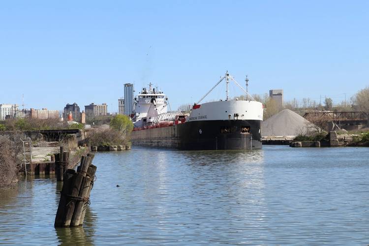 American Steamship Company’s M/V American Courage upbound on the Cuyahoga River in Cleveland, Ohio with a load of taconite from the iron ranges on Lake Superior for ArcelorMittal Cleveland, one of the most productive integrated steel mills in the world. (Photo Credit: Thomas Rayburn)