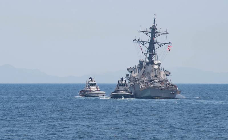 The Arleigh Burke-class guided-missile destroyer USS Fitzgerald (DDG 62) returns to Fleet Activities (FLEACT) Yokosuka following a collision with a merchant vessel while operating southwest of Yokosuka, Japan. (U.S. Navy photo by Kryzentia Weiermann)