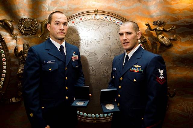USCG aviation survival technicians Randy Haba and Daniel Todd were awarded for the rescue of 14 crew members aboard HMS Bounty during Hurricane Sandy.