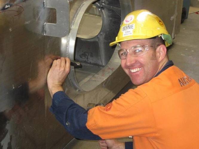 Bernard Gorman, Supervisor - Austal, applying the classification society stamp (Photo: Austal)