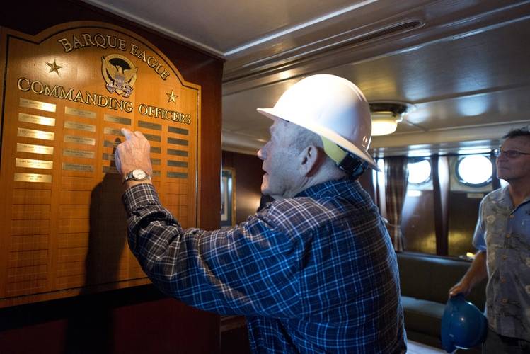 Briggs points to the names of commanding officers he served with through 1947-1950. (Photo: Jasmine Mieszala)