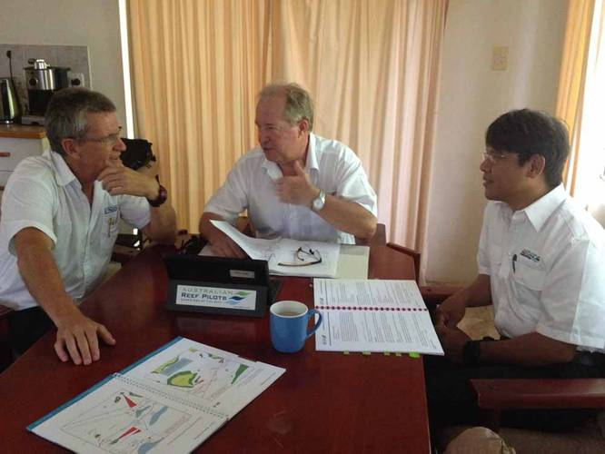 Capt. Perry (Center) going through some docs at the Cairns Pilot House with Capt. McGrath (Left) and Capt. Andrew Chai (right) Photo credit: Australian Reef Pilots Pty Ltd.
