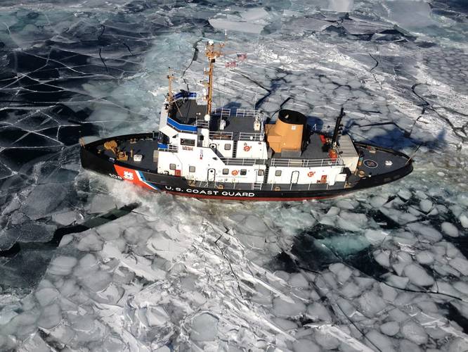 The Coast Guard Cutter Thunder Bay breaks ice in the Straits of Mackinac between Lake Huron and Lake Michigan. (U.S. Coast Guard photo)