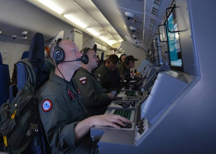 Crew members on board a P-8A Poseidon assigned to Patrol Squadron (VP) 16 man their workstations while assisting in search and rescue operations for Malaysia Airlines flight MH370. VP-16 is deployed in the U.S. 7th Fleet area of responsibility supporting security and stability in the Indo-Asia-Pacific. (U.S. Navy photo by Eric A. Pastor)