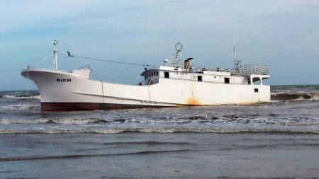 A derelict vessel, Rich, aground on Sargent Beach Thursday, located about 20 miles south of Freeport. USCG photo