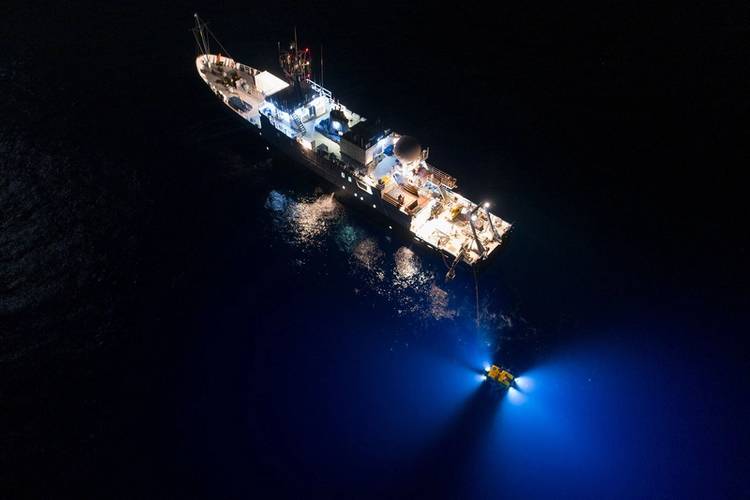 Drones filming from above reveal Hercules as it scours the ocean floor day and night for any sign of the famous aviator who disappeared in 1937. (Rob Lyall/National Geographic Image Collection)