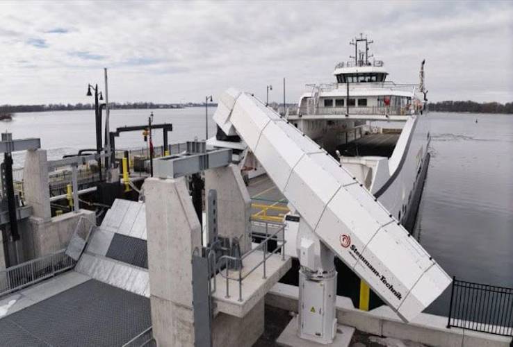 
An example of a charging arm mounted on a platform near the terminal. Once a vessel is secured at the dock, the arm connects, delivers power, and disconnects before departure. Image courtesy Washington State DOT
