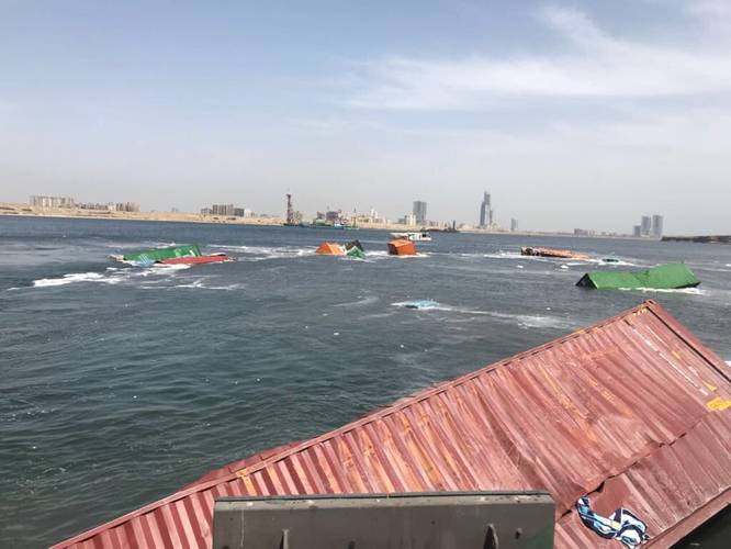 Fallen containers – some submerged, some floating – at the South Asia Pakistan Terminal in the Port of Karachi (Photo: Hassan Jan)