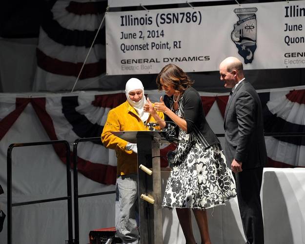 First Lady Michelle Obama, the sponsor for submarine Illinois, approves the weld of her initials, which is now permanently affixed in the ship. (Photo: General Dynamics Electric Boat)
