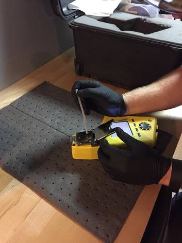 FluidScan handheld device only requires a single drop of oil for testing (Photo courtesy USCG)